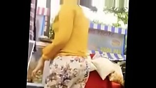 girlfriend gives her boyfriend a handjob in public